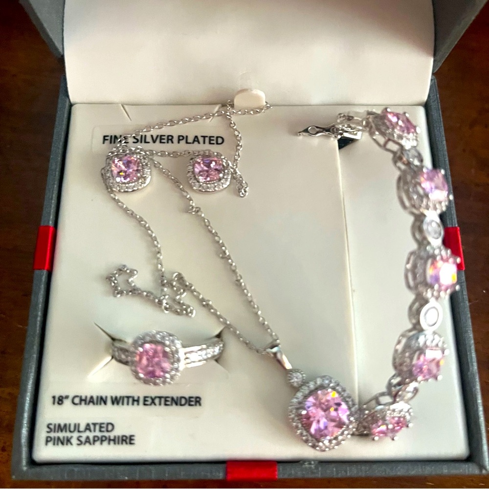 Fine silver plated 18” chain with extended simulated pink sapphire.